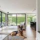 Featured image for a blog about How to Train a Guard Dog German Shepherd, showing a modern home with smart security devices like cameras, motion sensors, and alarms, in landscape format, realistic style.